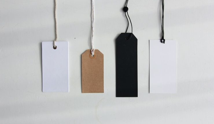 four paper card tags