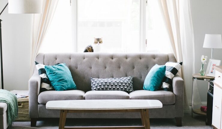brown and white wooden table beside sofa chair
