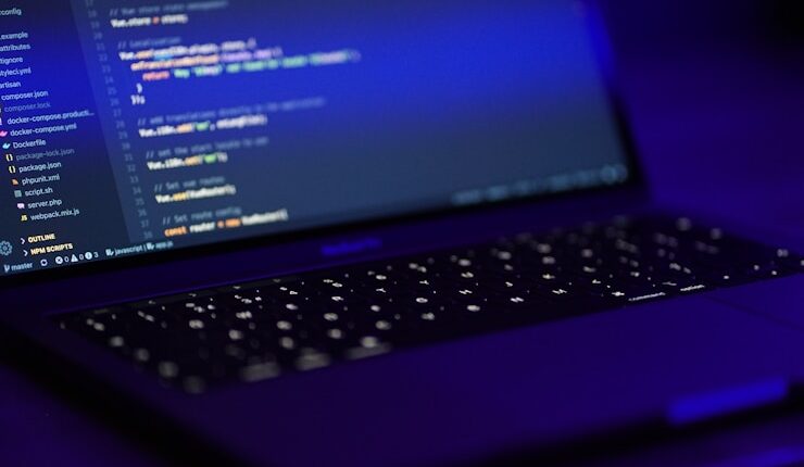 black laptop computer turned on displaying blue screen